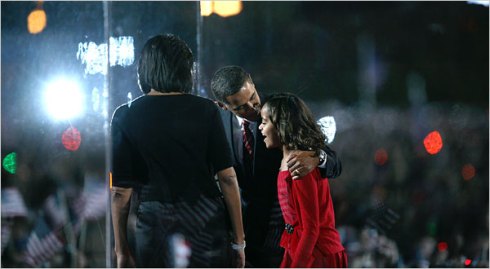 Senator Barack Obama kissed his daughter Malia while his wife, Michelle, looked on Tuesday night in Chicago.